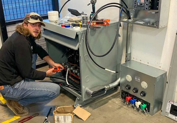 A skilled electrician is working on an electrical panel, ensuring safety and functionality.