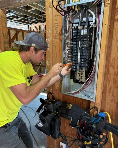 Professional residential electrical installation by Mizo Electric showing circuit breaker panel wiring in new construction home with organized electrical system installation in San Diego County