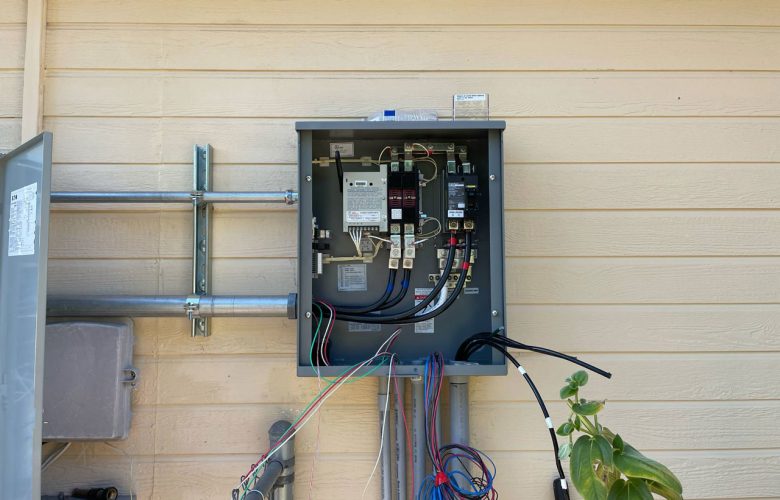 A professional installation of an outdoor electrical panel with organized wiring, ensuring safe power distribution.